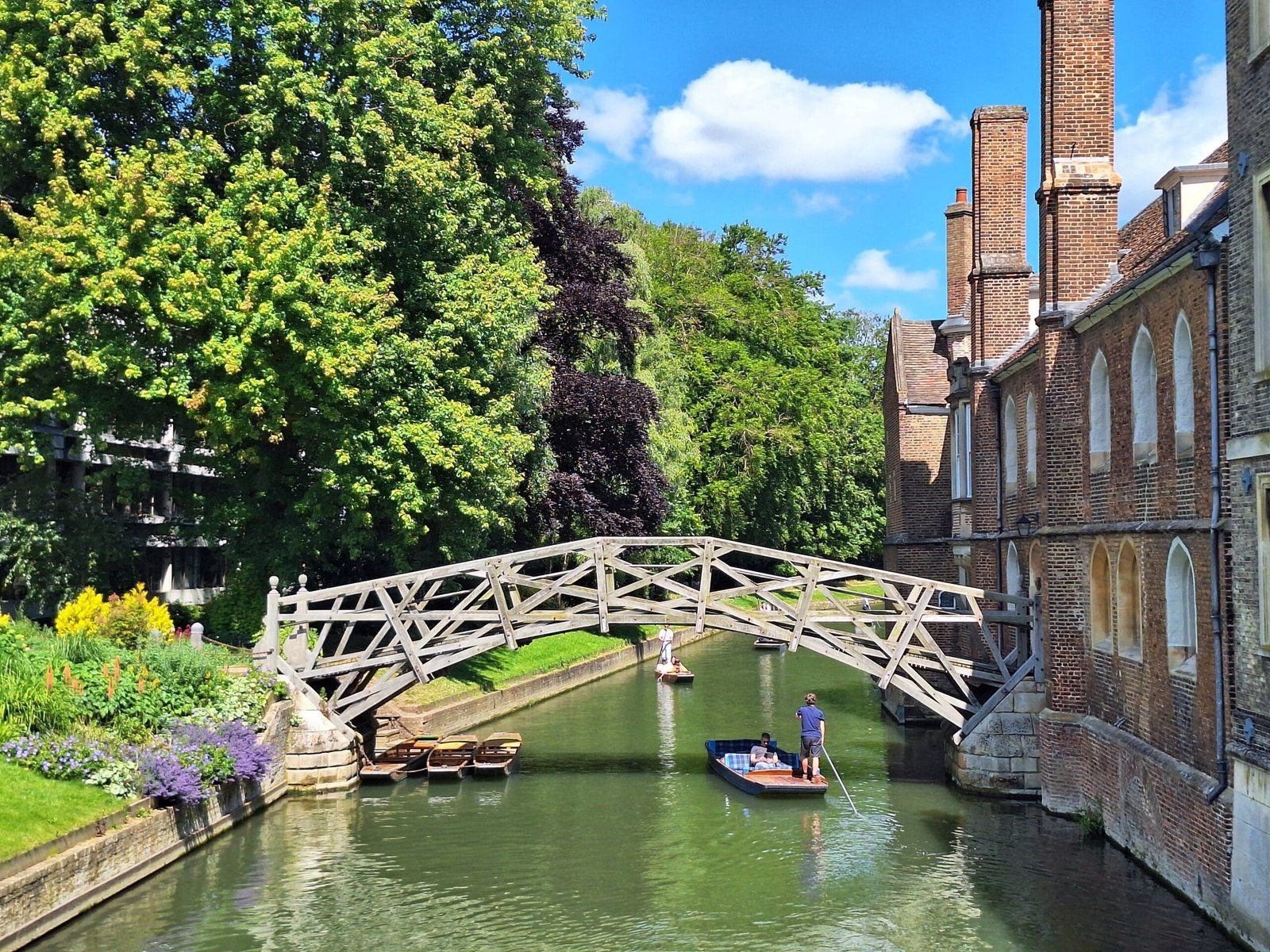 A punt passing beneath the Mathematical Bridge on the River Cam, Cambridge.