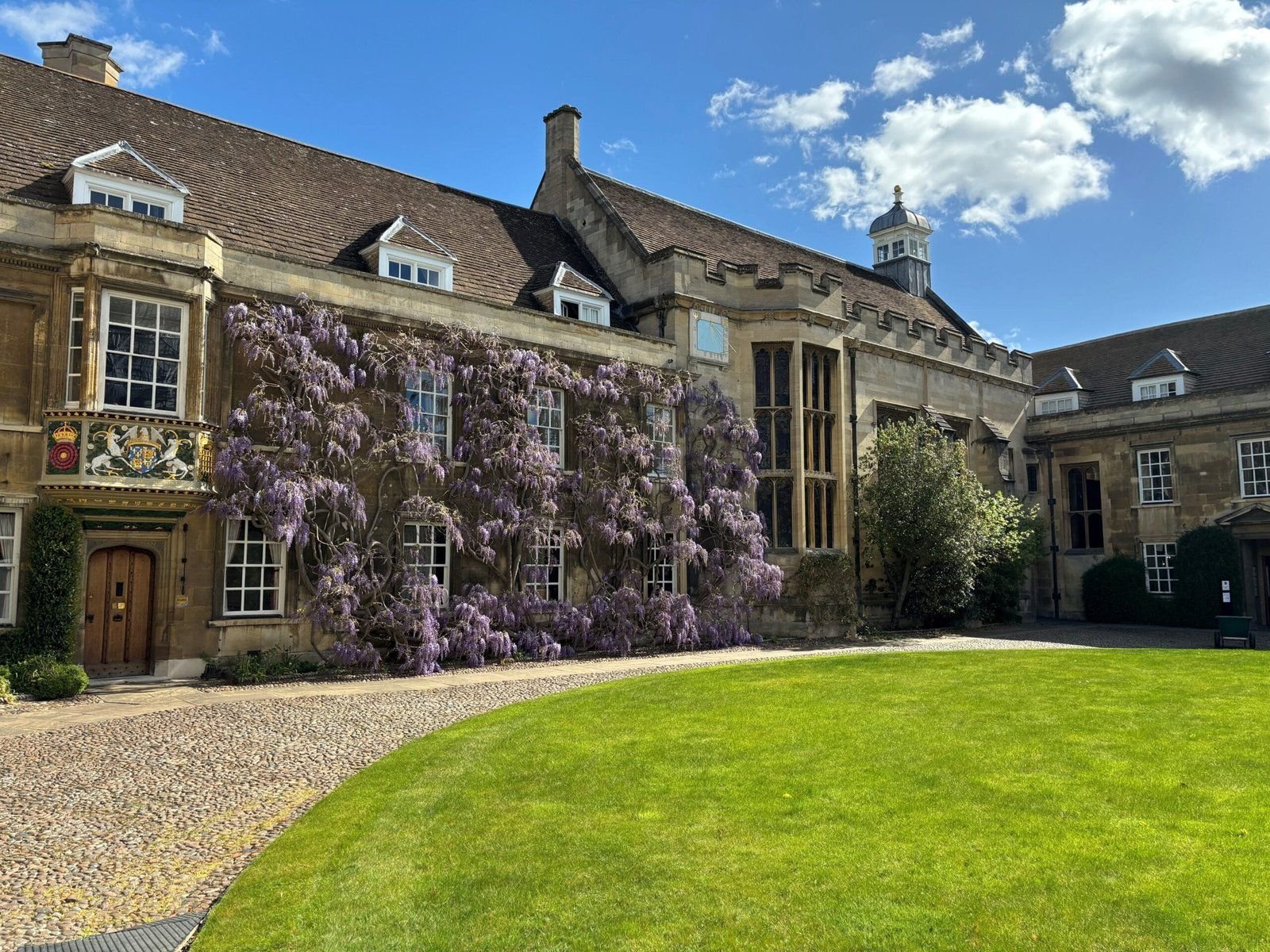 Wisteria in bloom on the historic stone walls of First Court, Christ’s College, Cambridge.